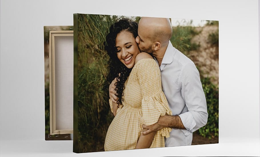 Artistic photograph of pregnant couple on stretched canvas