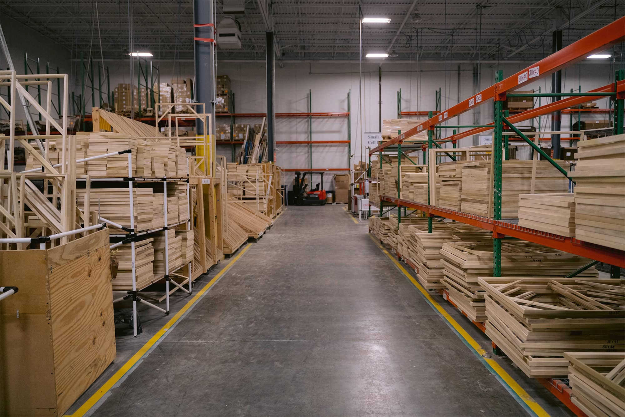 Reducing Factory Overhead Costs | Sensaria canvas stretcher bars in storage